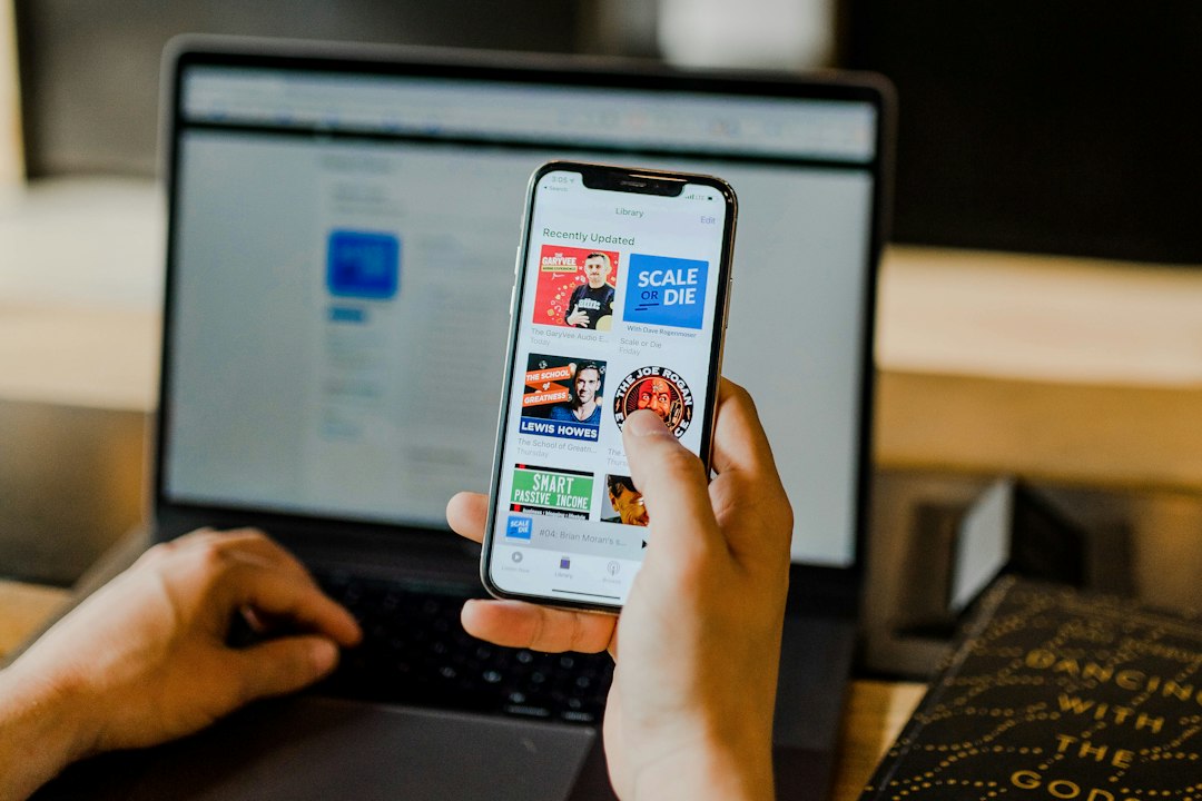 Smartphone and laptop representing Global Media and Information Literacy Week 2026