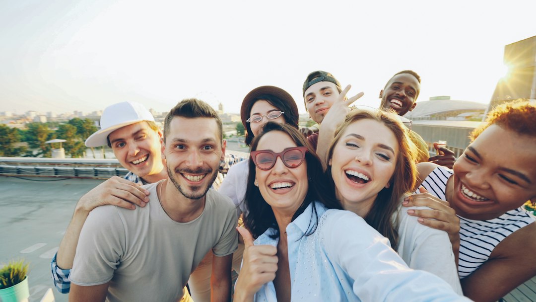 Happy smiling friends representing World Smile Day 2026
