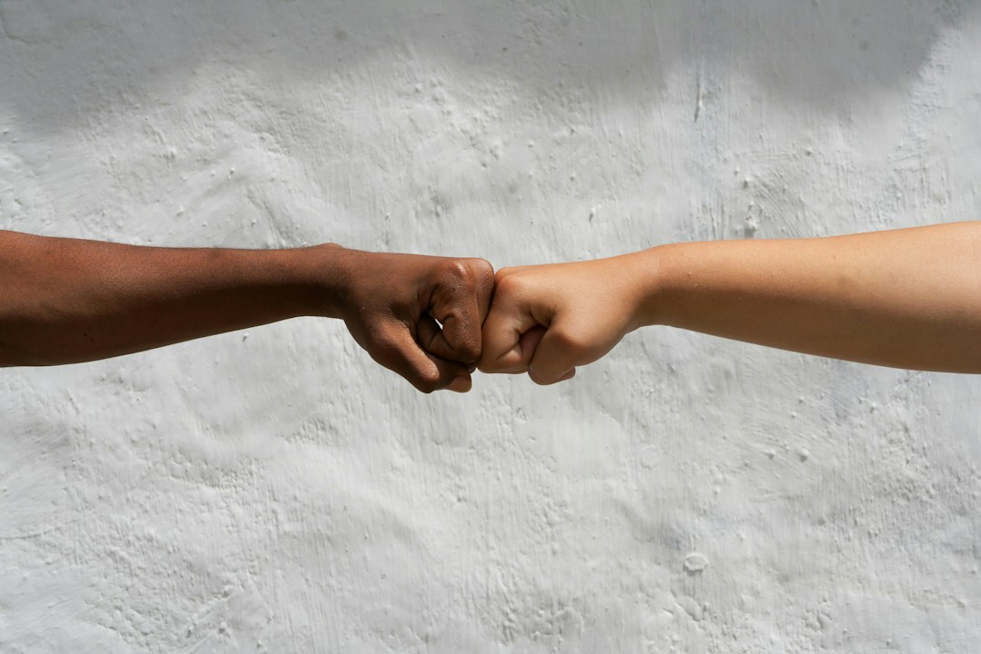 Diverse hands in solidarity representing freedom and equality for Abolition of Slavery Day 2026