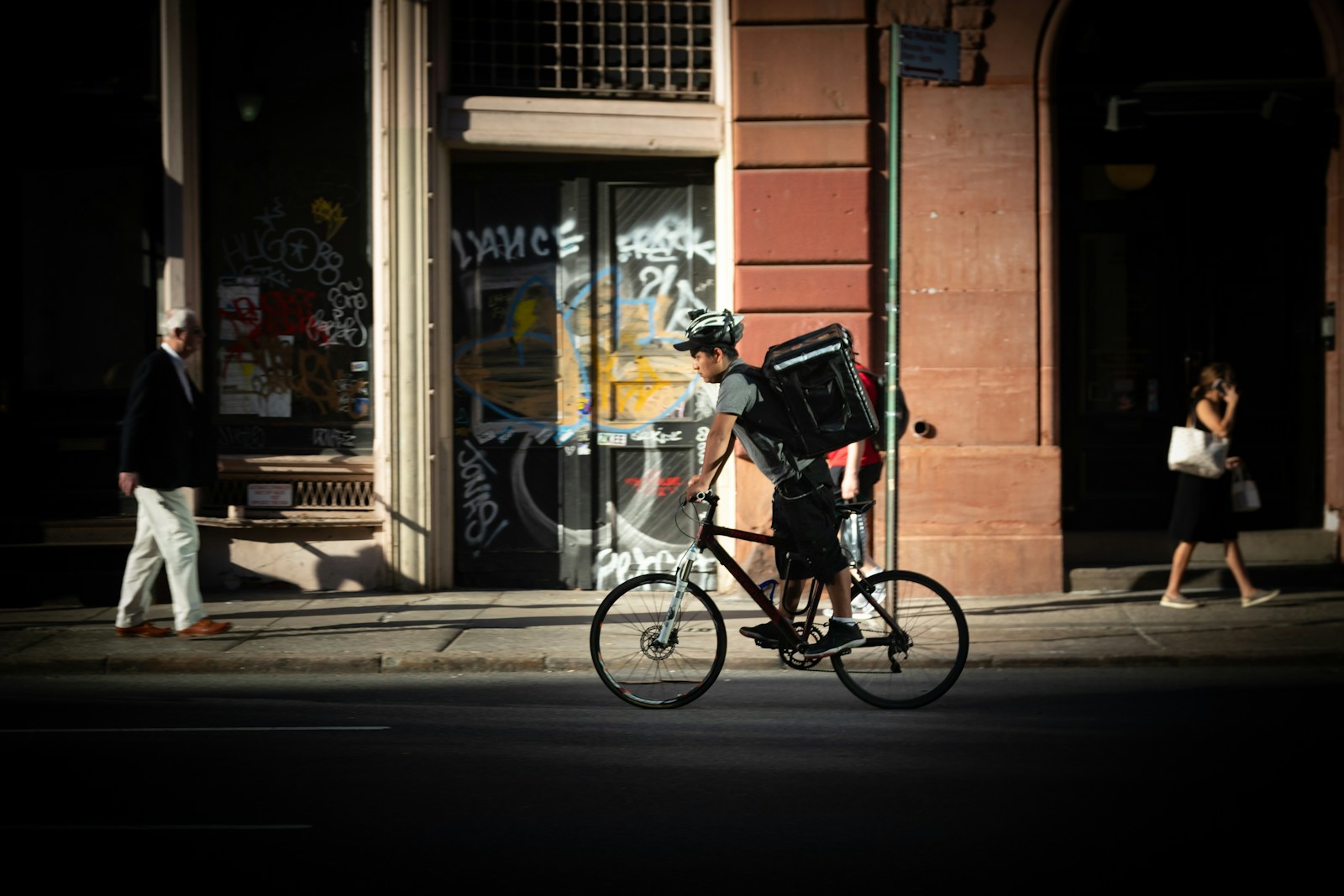 Delivery rider carrying shopping bags in a city, representing India's expanding ultra-fast delivery network