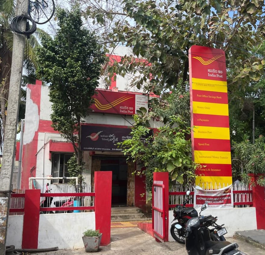 India Post office building with postal services signboard