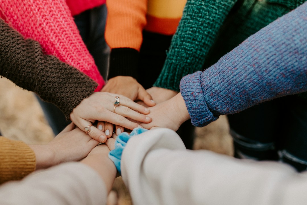 People joining hands to represent International Human Solidarity Day 2026