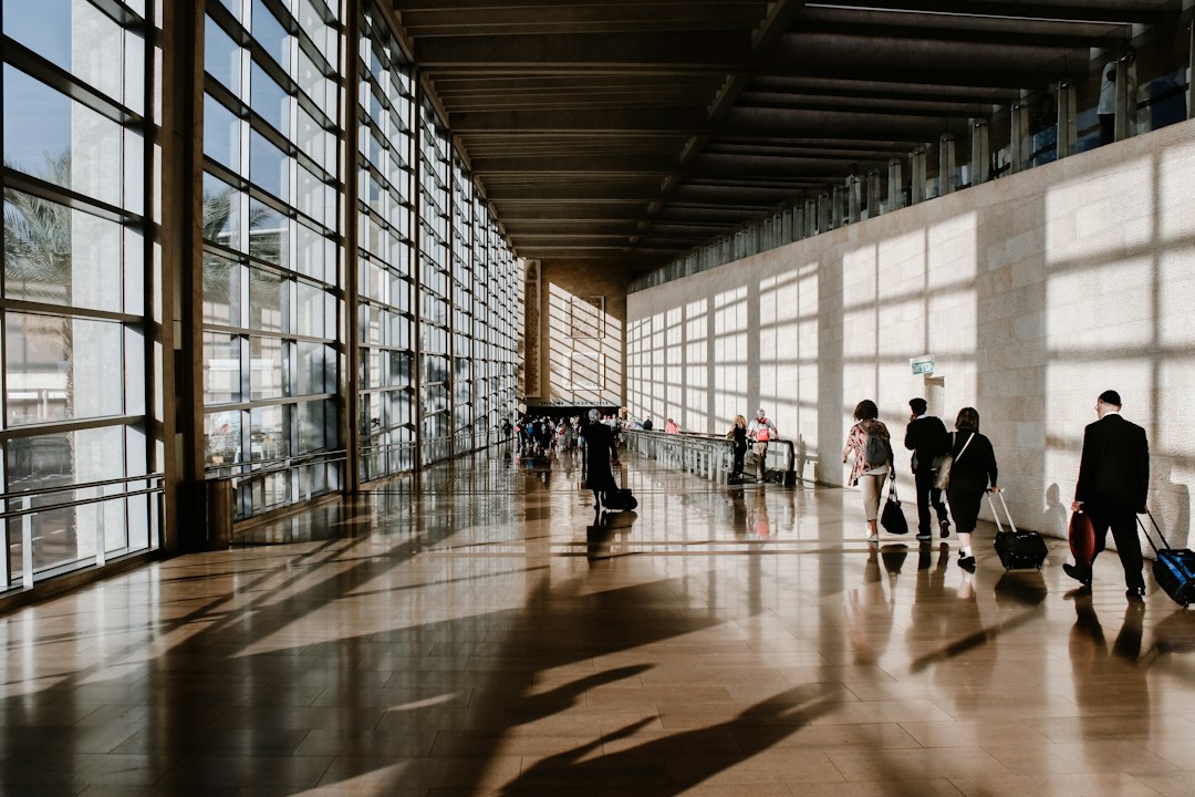 People travelling through an airport representing International Migrants Day 2026