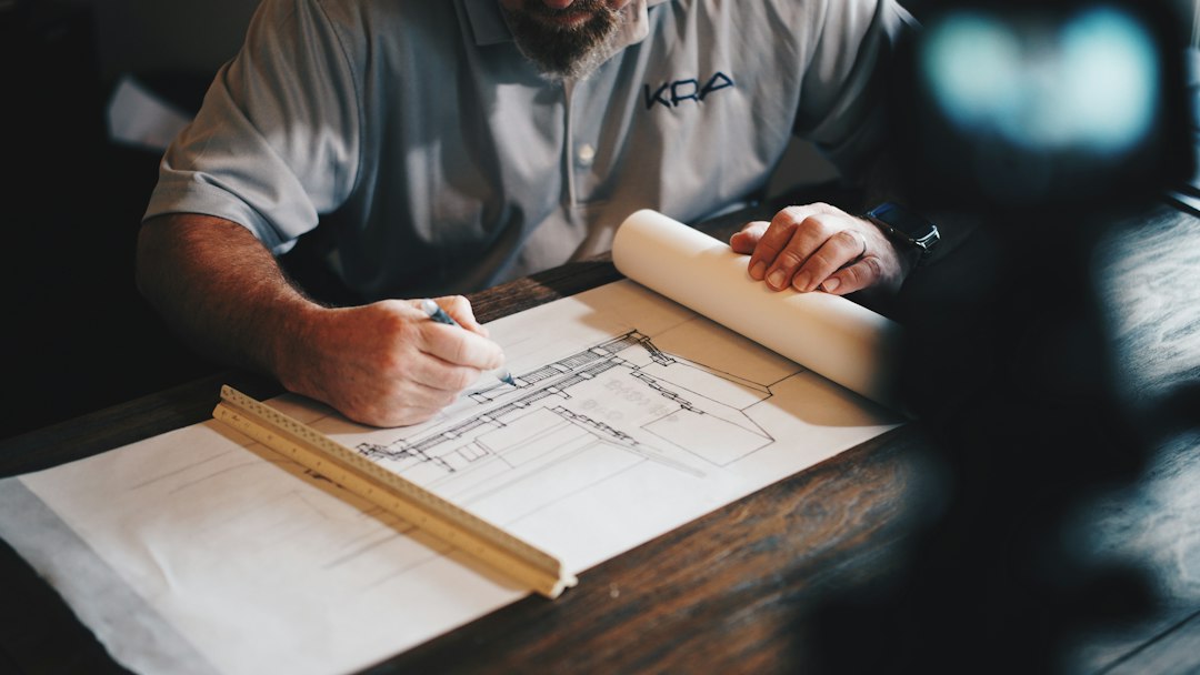 Architectural engineering plans and construction site for Sub Engineer recruitment